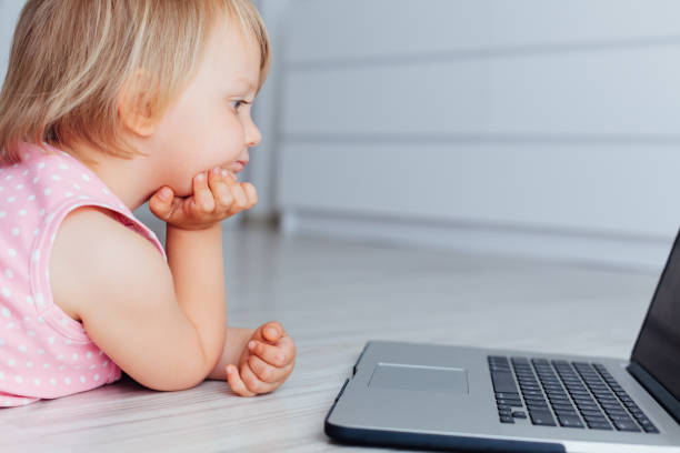 istock Girl Using Laptop On The Floor 1361700378
