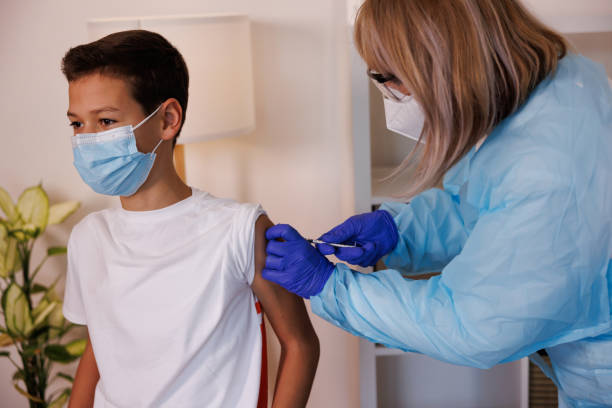 istock Injecting COVID-19 vaccine into patient's arm 1361702279