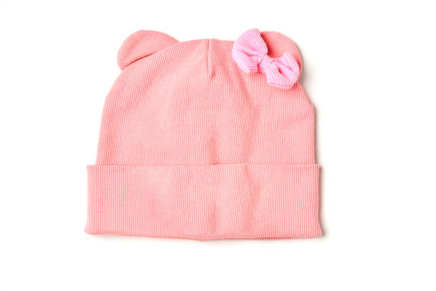 istock Warm pink baby hat with a bow 1361703167