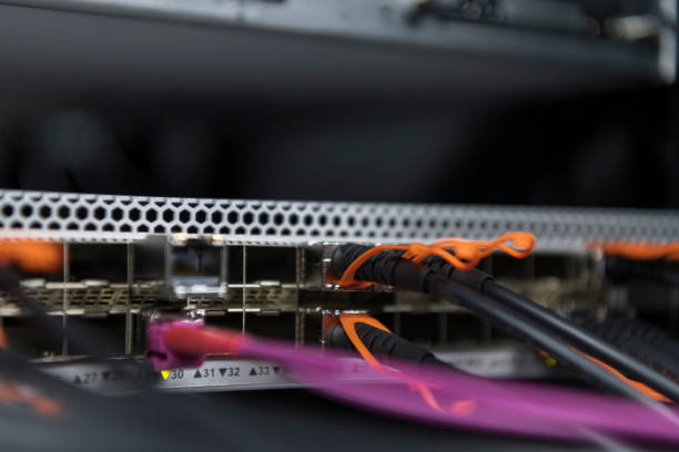 istock network server room closeup on fiber optic hub or switch for digital communications and internet in mainframe corporate business data center supercomputer. 1361707664