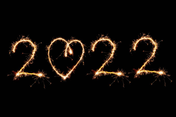 istock 2022 written with Sparkle firework on black background, happy new year 2020 concept 1361709893