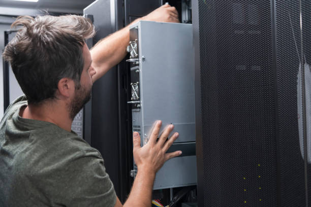 istock IT engineer working In the server room or data center The technician puts in a rack a new server of corporate business mainframe supercomputer or cryptocurrency mining farm. 1361712196