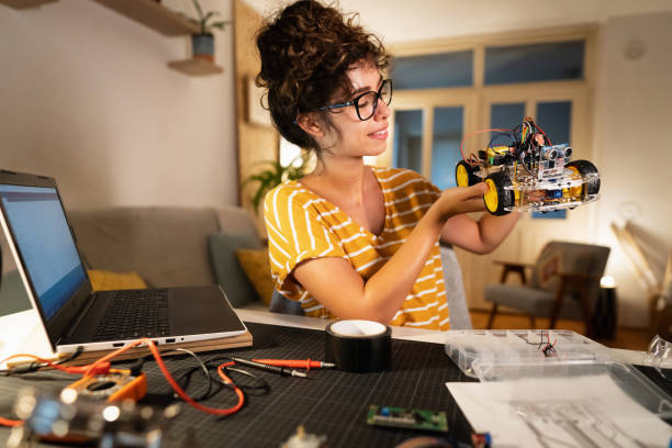 istock Innovative female engineer, successfully finished her prototype of robotic car 1361713370