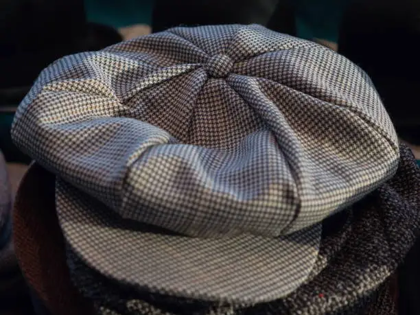 Close-up of a retro-style club hat with check pattern