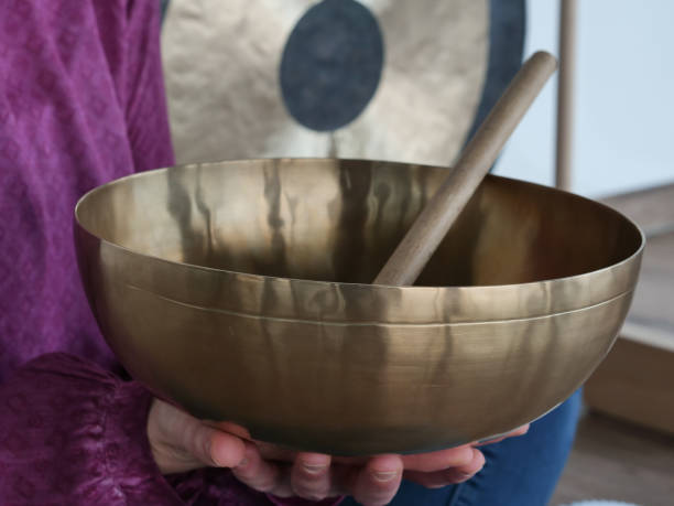 istock Large singing bowl in a woman's hand 1361713704