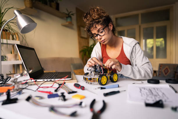 istock Dedicated robotic engineer, making an autonomous self-driven robotic car with sensors 1361713716