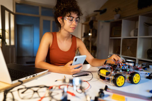 istock Before she starts with the first test of her robotic car prototype, a female student of robotic engineering checking all cables and inputs 1361715733