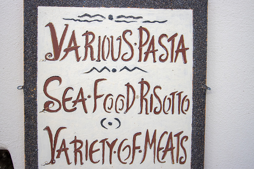 Seafood Risotto Sign in Firá on Santorini Caldera, Greece