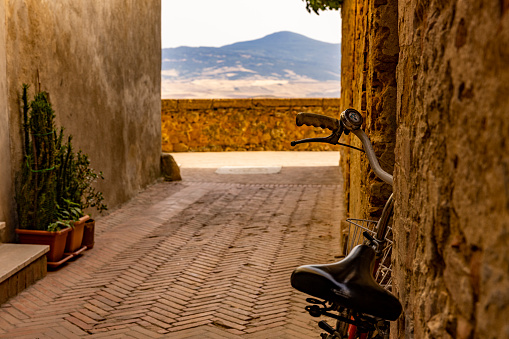 View of a bicycle in a small old town in Tuscany, Italy.