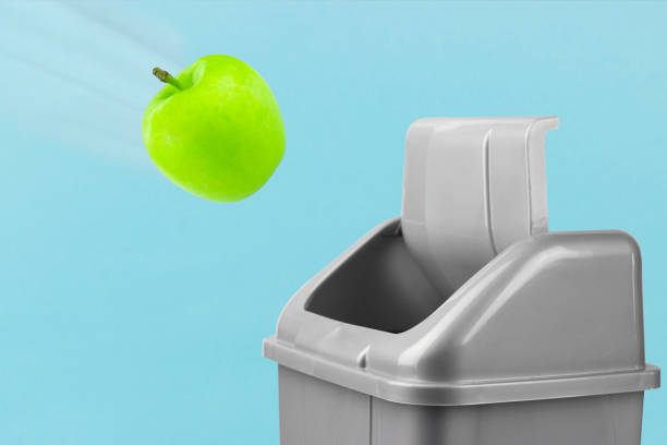 istock diet abandonment, green apple goes in the trash 1361720140