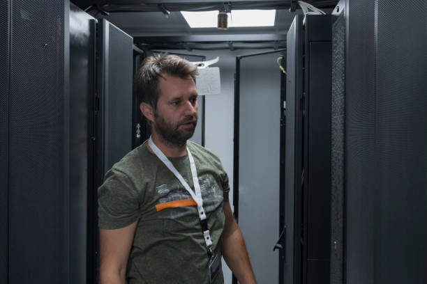 istock IT engineer working In the server room or data center The technician puts in a rack a new server of corporate business mainframe supercomputer or cryptocurrency mining farm. 1361720338