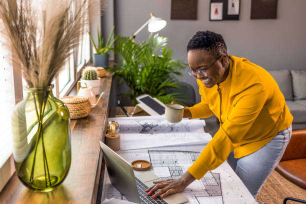 istock Young African-American woman architect working 1361720733