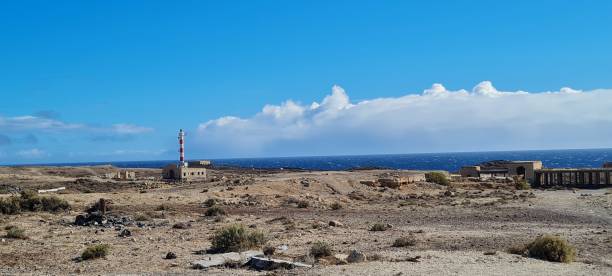 istock Desert, lighthouse and sea 1361720789