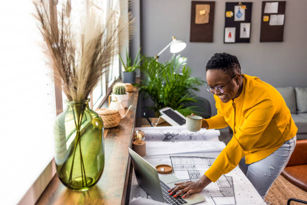 istock Young African-American woman architect working 1361720969