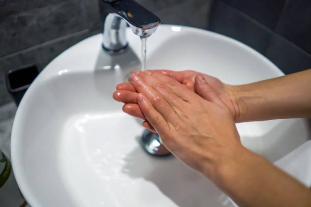 istock Woman is washing her hands with a soap. 1361722115