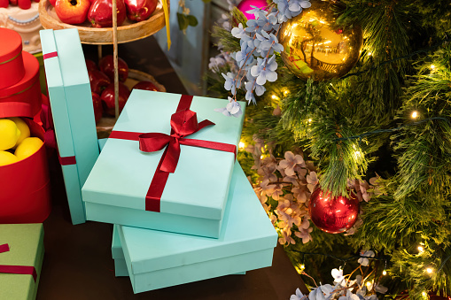 Stack of Christmas presents and gift boxes in Christmas holiday background.