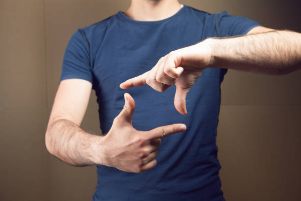 istock the man shows the frame with his fingers 1361725273