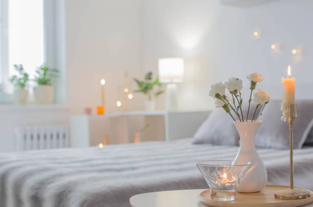 istock white flowers in vase on table in bedroom 1361729534