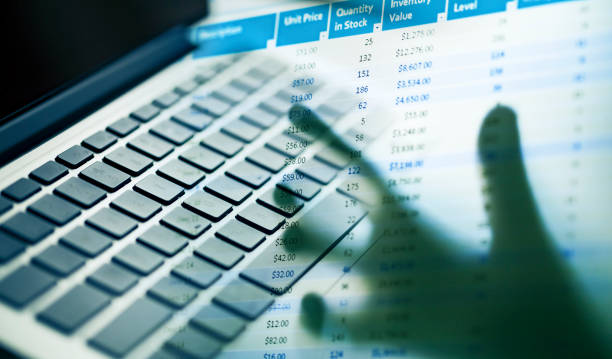 computer keyboard with financial data report stock photo