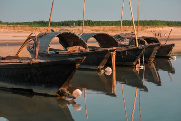 istock Anchored Wooden boats floating 1361732385