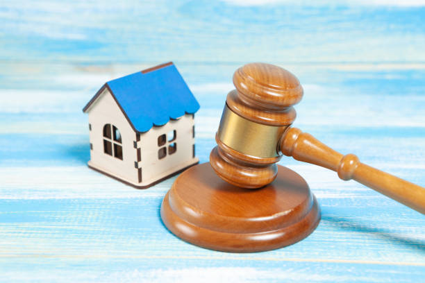 istock on the table the judge's hammer and the house. 1361733620