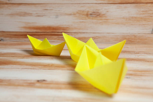 Happy New year concept. Paper ship and book
