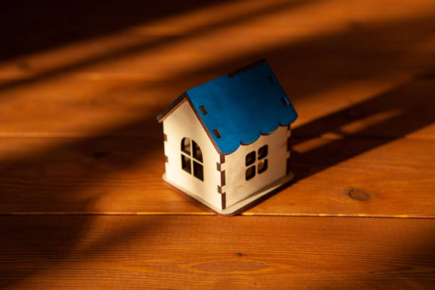 istock house on a wooden background. 1361733762