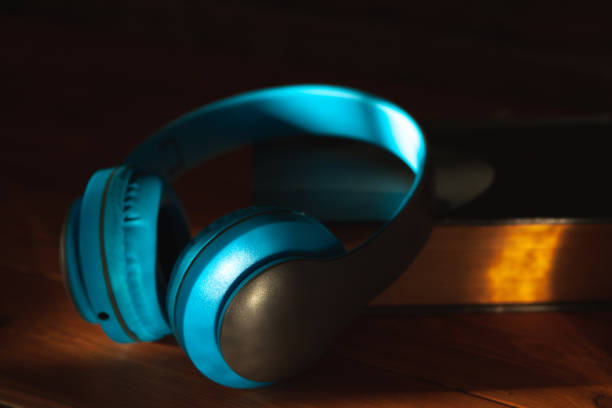 istock audiobook concept. book and headphones 1361733773