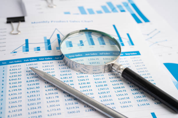 istock Magnifying glass on charts graphs paper. Financial development, Banking Account, Statistics, Investment Analytic research data economy, Stock exchange trading, Business office company meeting concept. 1361733801
