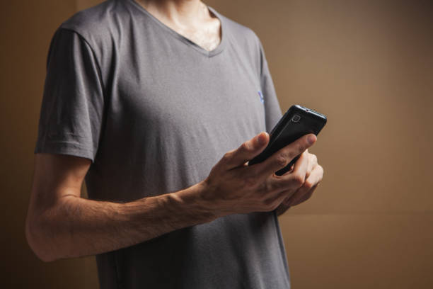 istock man presses on the phone screen 1361733867