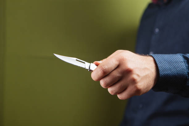 istock a man holding a hand knife 1361738141