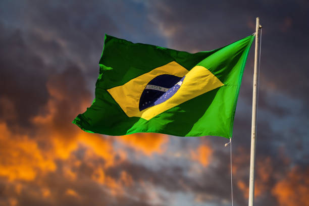 Brazilian flag flying and fluttering in the wind. stock photo