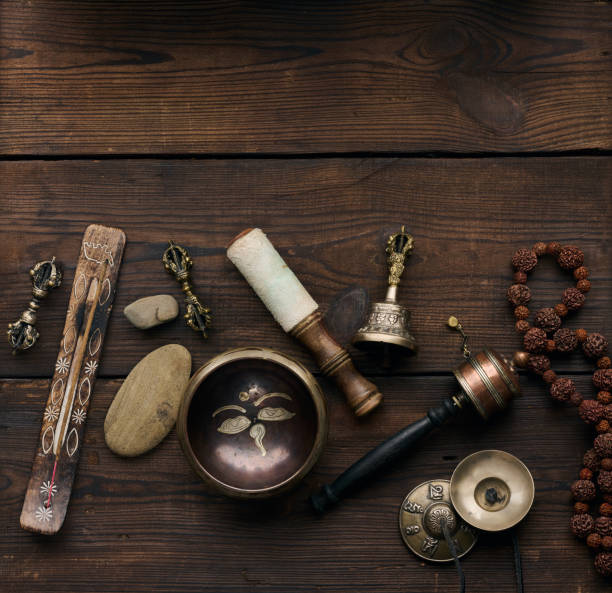 istock Tibetan singing copper bowl with a wooden clapper , objects for meditation and alternative medicine, top view 1361740001