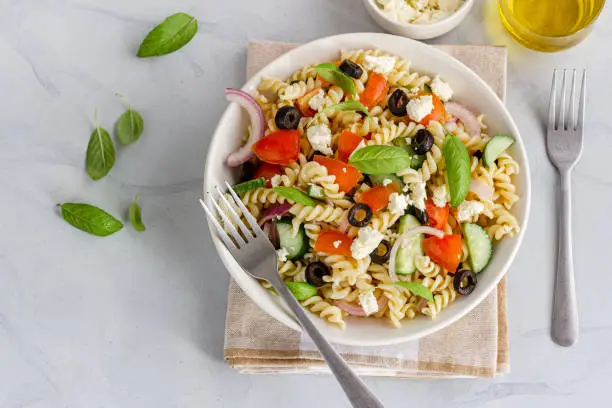 Pasta Salad in a Bowl on Whitebackground Top Down Photo