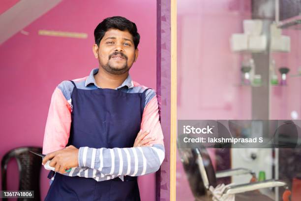Happy Smiling Hairdresser At Saloon Confidently Looking At Camera In Front Of Door Concept Of Happiness Professional Successful Business And Positive Emotion Stock Photo - Download Image Now