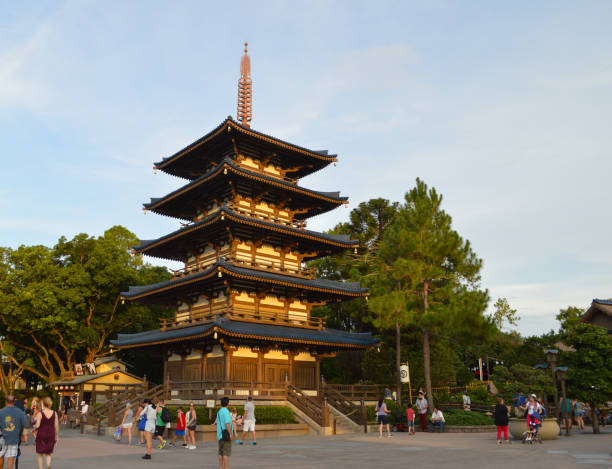Florida, United States, July 23, 2021 :  People like to circulate around in Epcot to watch the different monument. They are discovering here a pagoda from China which contained diferent level and with the roof curving upward
