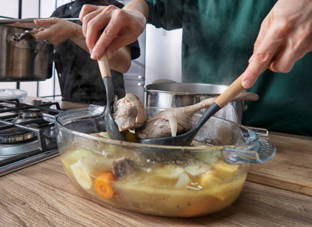 istock Frying pan on a gas stove. Chef controls the cooking process 1361746405