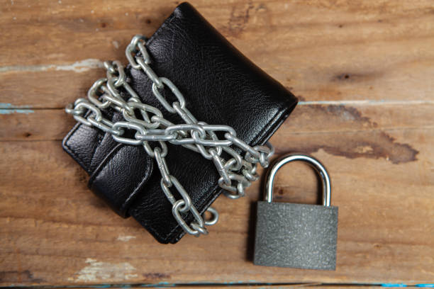 istock the wallet in chains is closed with a padlock 1361747450