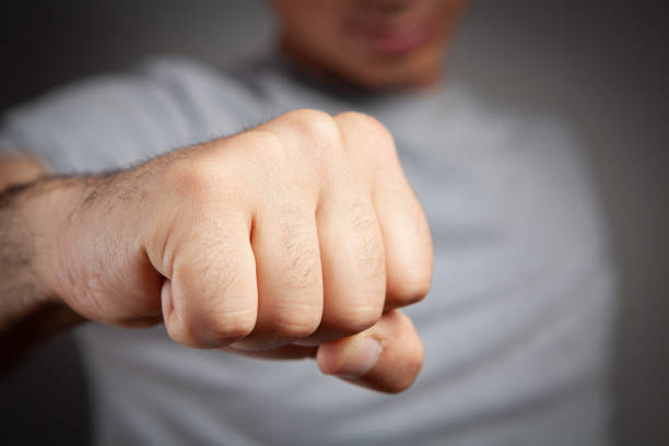 istock man showing fist 1361747730