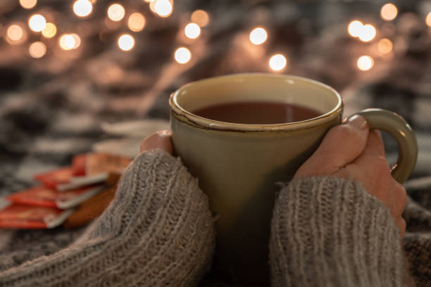 istock woman hands holding cup of tea 1361748879