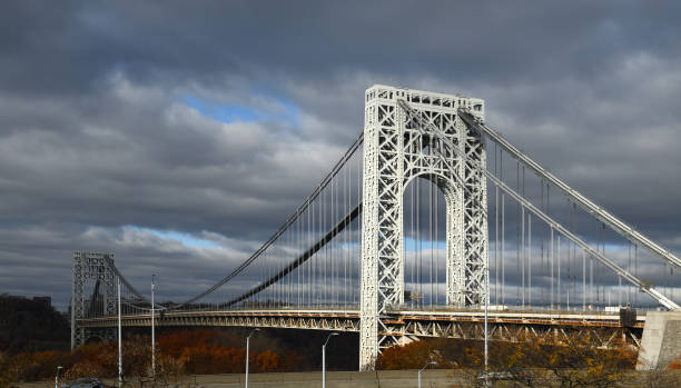 istock George Washington Bridge, double-decked suspension bridge spanning Hudson River against background of dark clouds. New York City, United States 1361749052