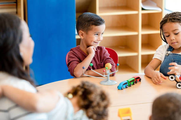 istock Adorable little boy enjoying preschool class 1361756660