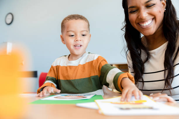 istock Child psychologist uses emotion cards during session 1361756675