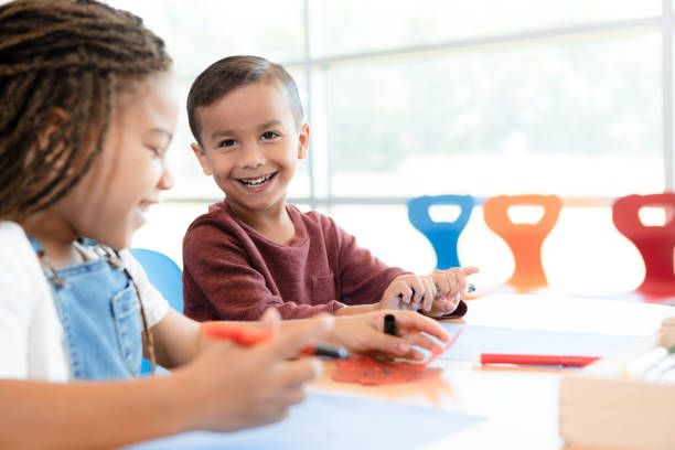 istock Happy little boy enjoying art class 1361756692