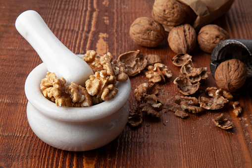 cracking walnuts on a wooden background