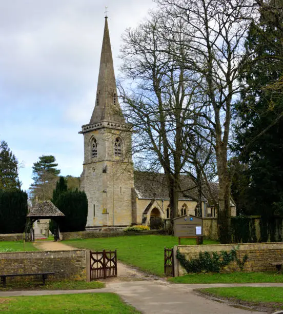 The church of St Mary in the Cotswolds village of Lower Slaughter., with a Norman tower and steeple.