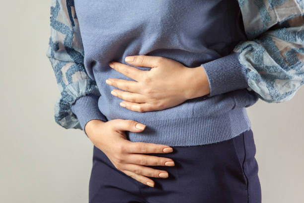 istock woman hand in ache stomache 1361762152