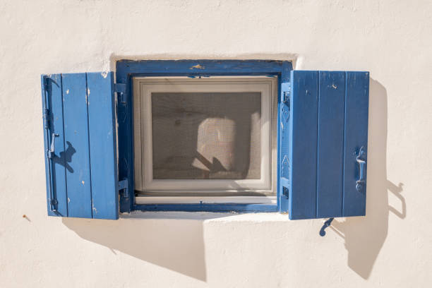 istock Blue window on white wall in Mykonos, Greece 1361764179