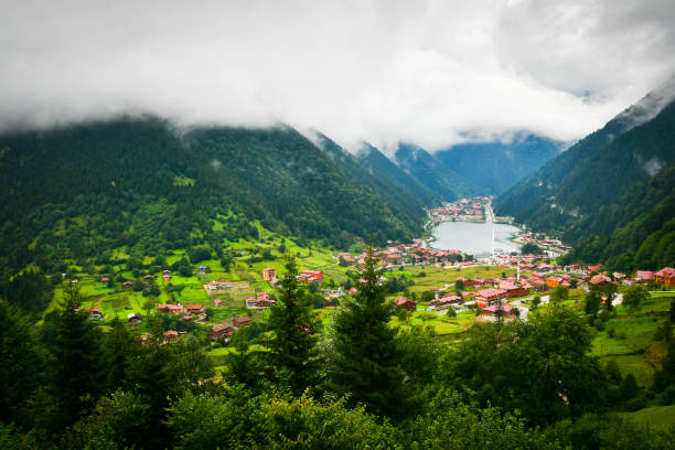 greenery with stunning mountain lake with turquoise water with beautiful homes in mountains village uzun gol in karadeniz - long imagens e fotografias de stock
