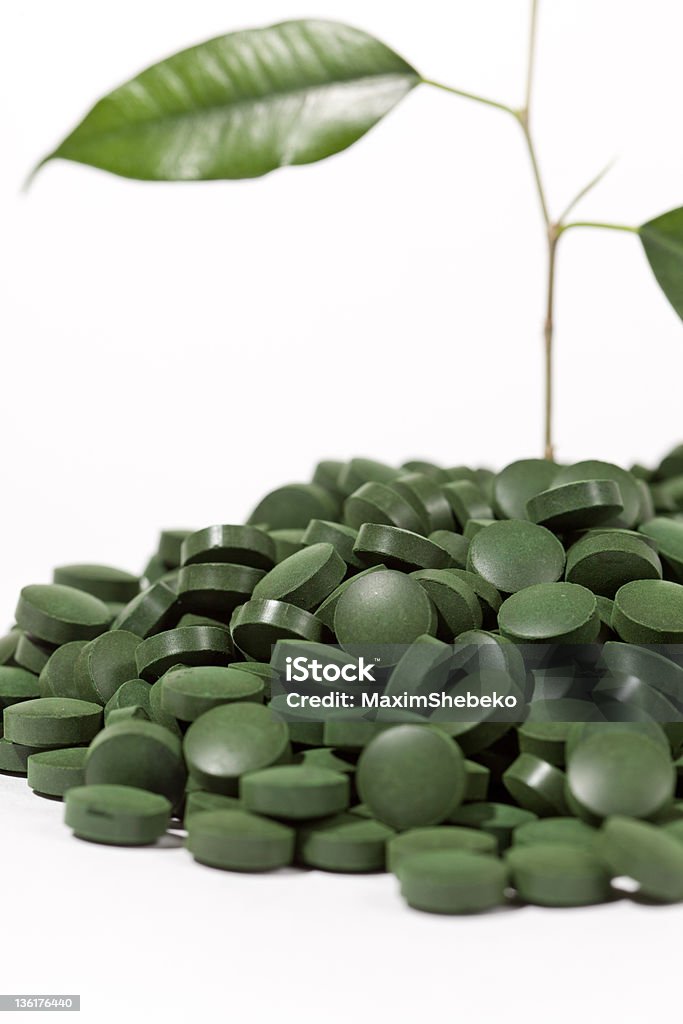 green pills Capsule - Medicine Stock Photo